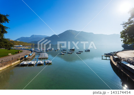 Lake Annecy at sunrise with mountains and town in France 143174454
