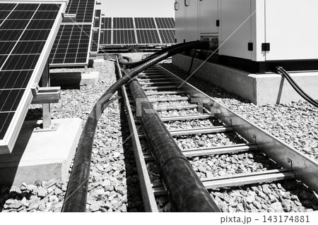 Industrial solar power plant installation with photovoltaic panels and electrical cable trays Industrial solar power plant installation with photovoltaic panels and electrical cable trays 143174881
