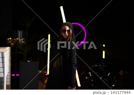 Nightlife ambiance captured with vibrant neon and reflective elements Nightlife ambiance captured with vibrant neon and reflective elements 143177944