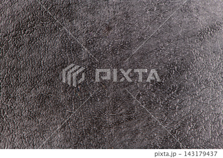 Dark grey leather texture background with rough grain and natural pattern Dark grey leather texture background with rough grain and natural pattern 143179437