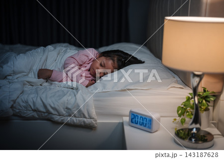 preschool child girl sleeping on bed at night 143187628