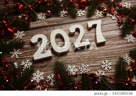 2027 Happy New Year and Christmas decoration on wooden background 2027 Happy New Year and Christmas decoration on wooden background 143190536