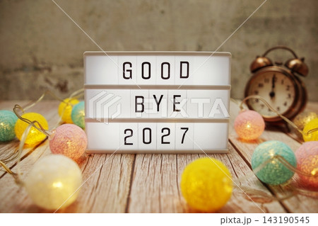 Goodbye 2027 text on lightbox on wooden background Goodbye 2027 text on lightbox on wooden background 143190545