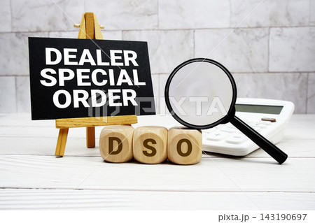 DSO Dealer Special Order text with calculator magnifying glass and on wooden background DSO Dealer Special Order text with calculator magnifying glass and on wooden background 143190697
