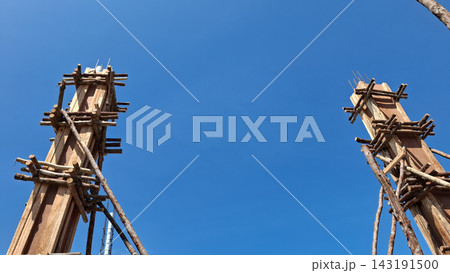 Two Wooden Concrete Column Molds on Construction Site Two Wooden Concrete Column Molds on Construction Site 143191500