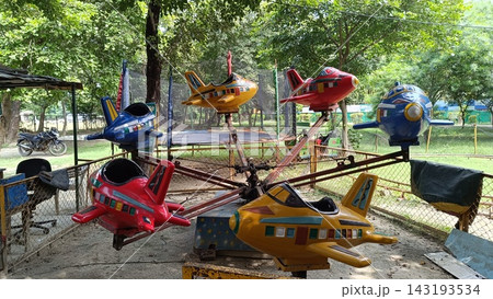 A picture of childrens playing equipment in city forest park 143193534