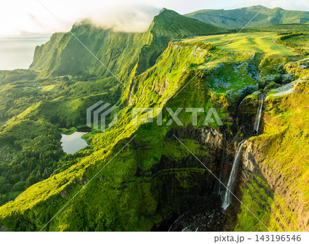 Ribeira Grande Waterfall, Green Lush Cliffs. Flores Island, Azores, Portugal Ribeira Grande Waterfall, Green Lush Cliffs. Flores Island, Azores, Portugal 143196546