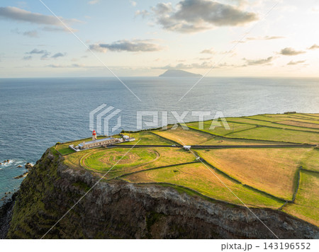 Farol do Albarnaz Lighthouse with Corvo Island View at Sunrise, Azores 143196552