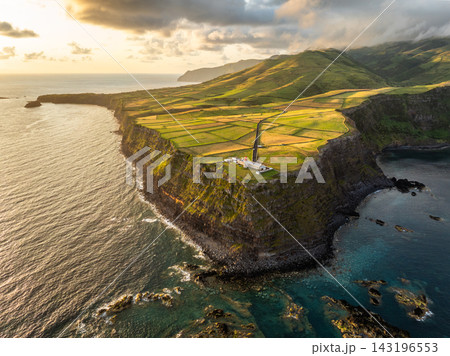 Golden Sunrise over Farol do Albarnaz Lighthouse, Flores Island, Azores Golden Sunrise over Farol do Albarnaz Lighthouse, Flores Island, Azores 143196553