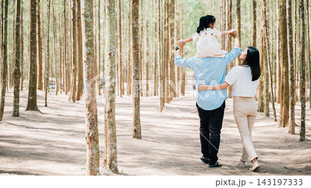 Family father carrying young girl shoulders while walking in forest with mother, Happy Asian family with adorable children in weekend, shoulder carry and happy family 143197333