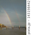 A Rainbow over The Beach in Fort Myers Beach Florida USA A Rainbow over The Beach in Fort Myers Beach Florida USA 143198442