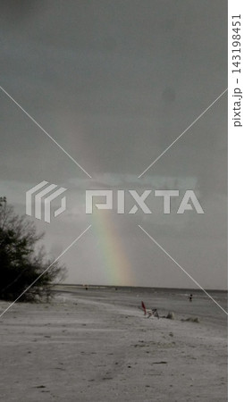 A Rainbow over The Beach in Fort Myers Beach Florida USA A Rainbow over The Beach in Fort Myers Beach Florida USA 143198451
