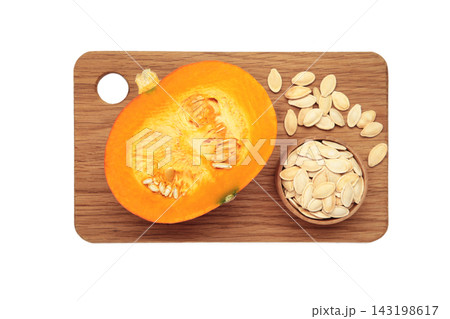 Sliced Hokkaido pumpkin with seeds on bowl isolated on white background. 143198617