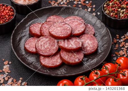 Sliced salami sausage, smoked meat as a delicacy for the table. Salami sausage 143201368