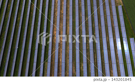 Solar panel field generating clean electricity for a greener future, aerial view of renewable energy farm Solar panel field generating clean electricity for a greener future, aerial view of renewable energy farm 143201845