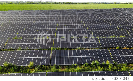 Solar farm generating clean renewable energy from photovoltaic panels across rural landscape, promoting sustainable powerful future Solar farm generating clean renewable energy from photovoltaic panels across rural landscape, promoting sustainable powerful future 143201848