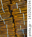 Close-up of Rusty Bent Rebar Bundles Secured with Straps 143202594