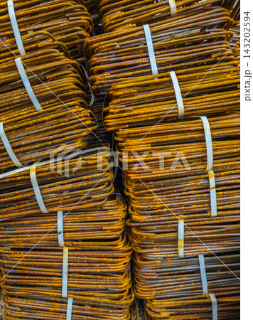 Close-up of Rusty Bent Rebar Bundles Secured with Straps 143202594