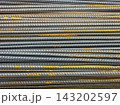 Stacked Rebar Rods with Rust Texture Close-Up 143202597