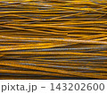 Close-up of Stacked Rusty Rebar in Construction 143202600