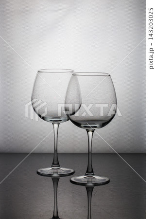 Still life with glassware on a gray background Still life with glassware on a gray background 143203025