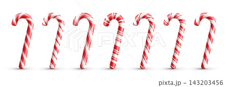 Classic red and white striped candy canes on a white background. Classic red and white striped candy canes on a white background. 143203456
