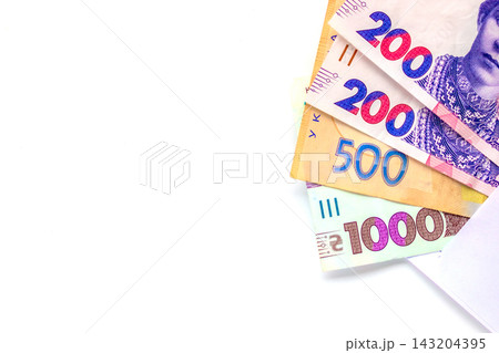 Ukrainian banknote cash peeking from envelope on white background for finance and payment uses 143204395