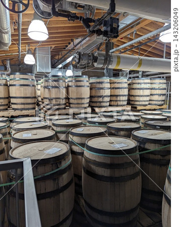 Hundreds of Bourbon Whiskey Barrels Stacked High for Slow Aging. Hundreds of Bourbon Whiskey Barrels Stacked High for Slow Aging. 143206049
