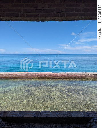 Scenic View of the Ocean from Dry Tortugas National Park Fort Window. Scenic View of the Ocean from Dry Tortugas National Park Fort Window. 143206113