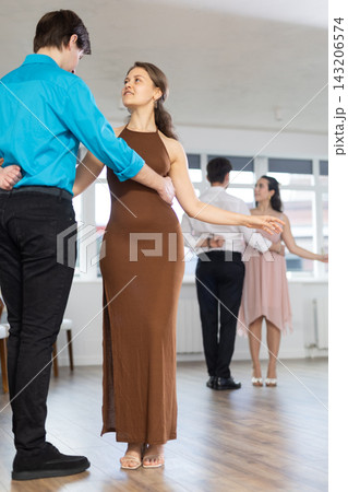 During rehearsal, guy and girl participants of dance workshop perform figure waltz 143206574