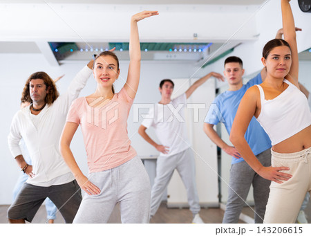 Group of different people rehearsing dance in dance studio Group of different people rehearsing dance in dance studio 143206615