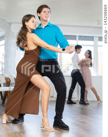Couple young woman and man dancing latin dances Couple young woman and man dancing latin dances 143206669