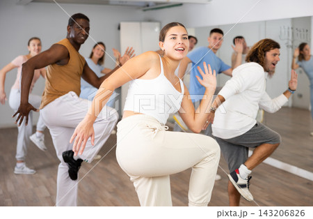 Group of different people rehearsing dance in dance studio Group of different people rehearsing dance in dance studio 143206826