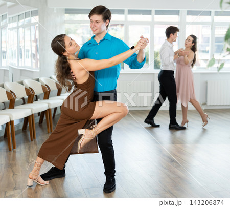 Graceful young duet dancing passionate tango at dance class 143206874