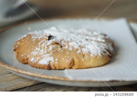 Large cookie placed on a paper towel, ready to be served in a cafe 143209680