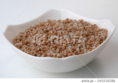 groats in plate on white groats in plate on white 143210286