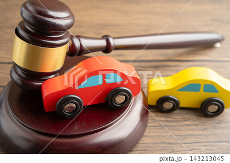 Car accident lawsuit and insurance, Judge hammer with car model. 143213045