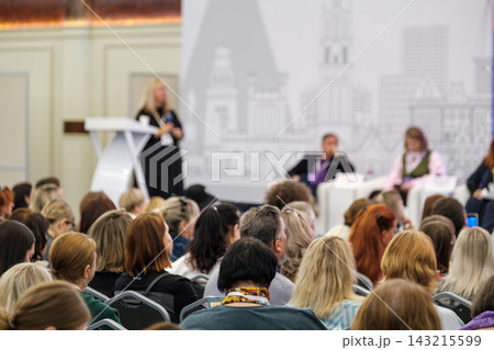 Conference audience facing speakers during a panel discussion Conference audience facing speakers during a panel discussion 143215599