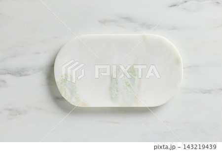 new empty white stone tray on white marble kitchen table top background new empty white stone tray on white marble kitchen table top background 143219439