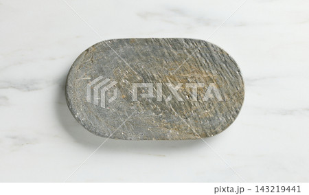 new empty grey stone tray on white marble kitchen table top background new empty grey stone tray on white marble kitchen table top background 143219441