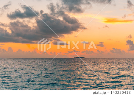 Dramatic golden sunset glowing clouds calm tropical sea warm horizon soft light layered sky. Scenic nature landscape print. Fine art poster wall piece Dramatic golden sunset glowing clouds calm tropical sea warm horizon soft light layered sky. Scenic nature landscape print. Fine art poster wall piece 143220418