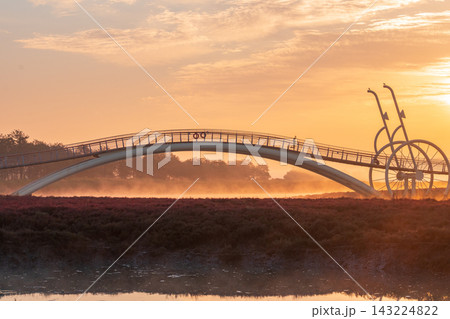 Sunrise Dawn over Misaeng Bridge with Water Reflection in Siheung Wetland, South Korea 143224822