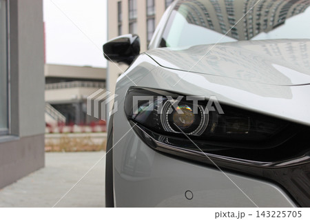 Front Of Car Parked In Front Of Residential And Office Building Complex. City Transportation and Parking Stock Photo Front Of Car Parked In Front Of Residential And Office Building Complex. City Transportation and Parking Stock Photo 143225705