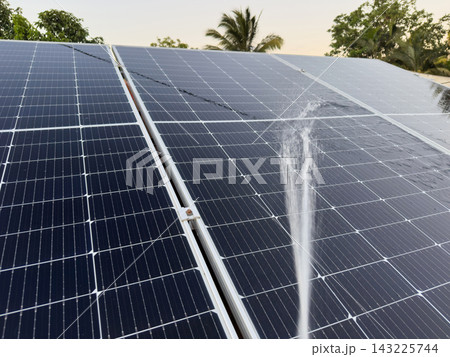 Clean solar panels under spray water Clean solar panels under spray water 143225744