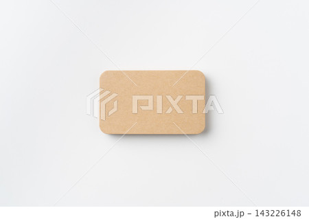 Top view of blank kraft paper business card with rounded corners isolated on white background with copy space 143226148