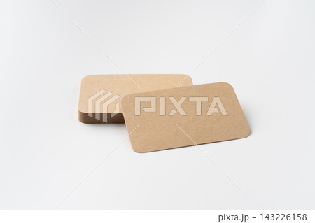 Perspective view of stack of blank kraft paper rounded corner business cards isolated on white background with copy space Perspective view of stack of blank kraft paper rounded corner business cards isolated on white background with copy space 143226158