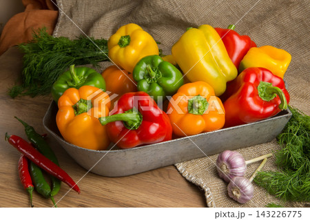 Red, green and yellow sweet bell peppers on table, Red, green and yellow sweet bell peppers on table, 143226775