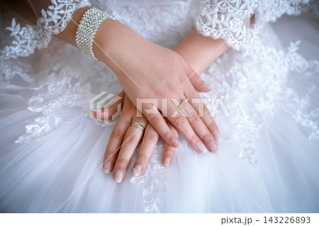 engagement rings at the hands of the newlyweds engagement rings at the hands of the newlyweds 143226893