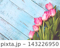 tulips on a blue background. the photo is stylized into a drawing 143226950