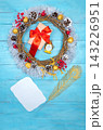 Christmas beautiful wreath on a wooden table, New Year decoration, 143226951